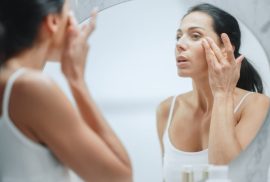 woman applying skincare