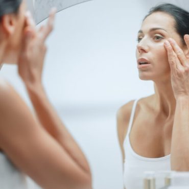 woman applying skincare