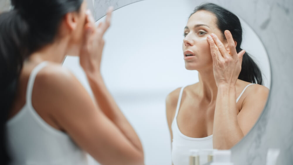 woman applying skincare